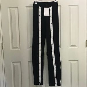Black and white snap front track pants